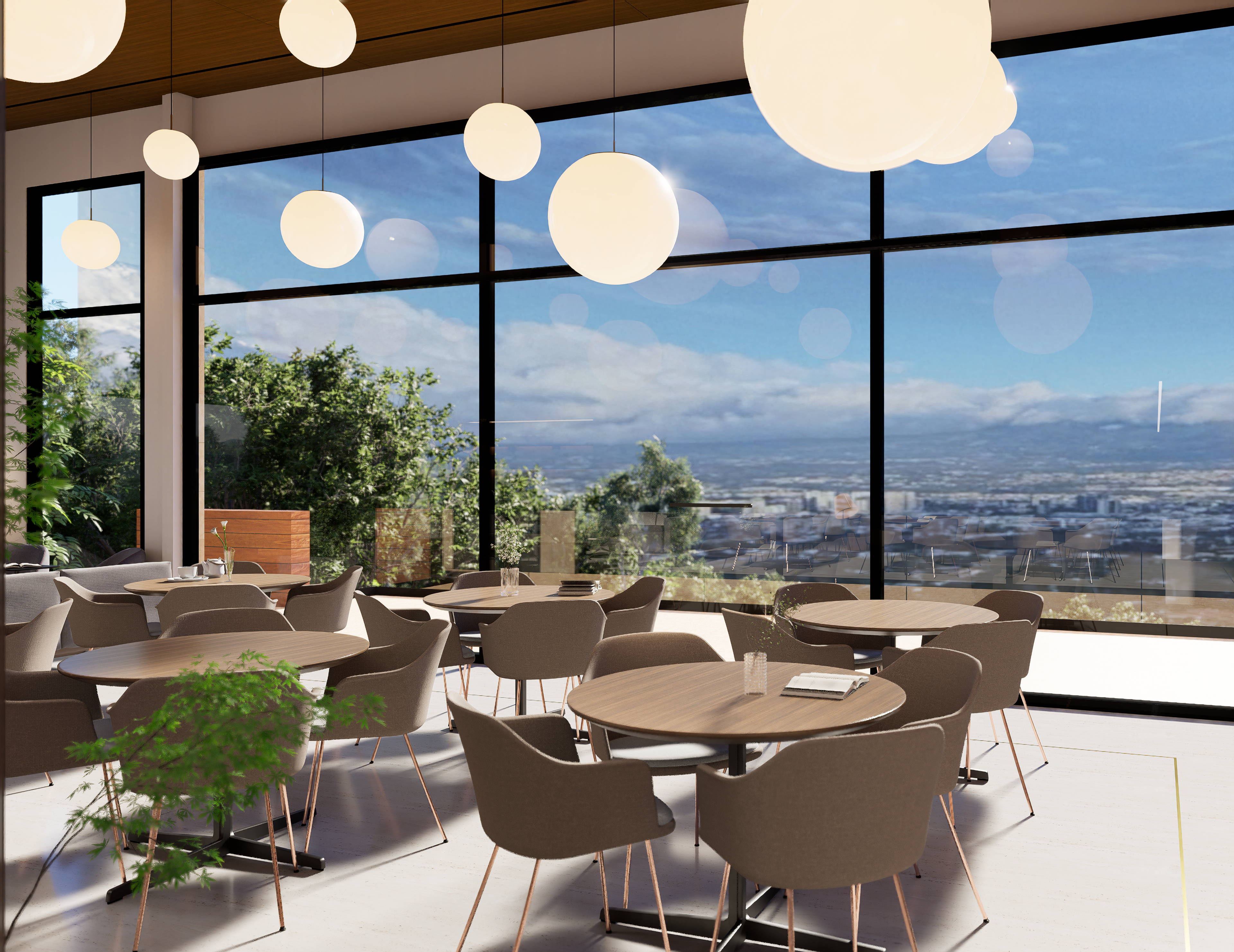 Salón social con ventanales de piso a techo y vista panorámica al Valle Central
